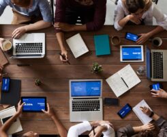 Top View Photo Of People Near Wooden Table